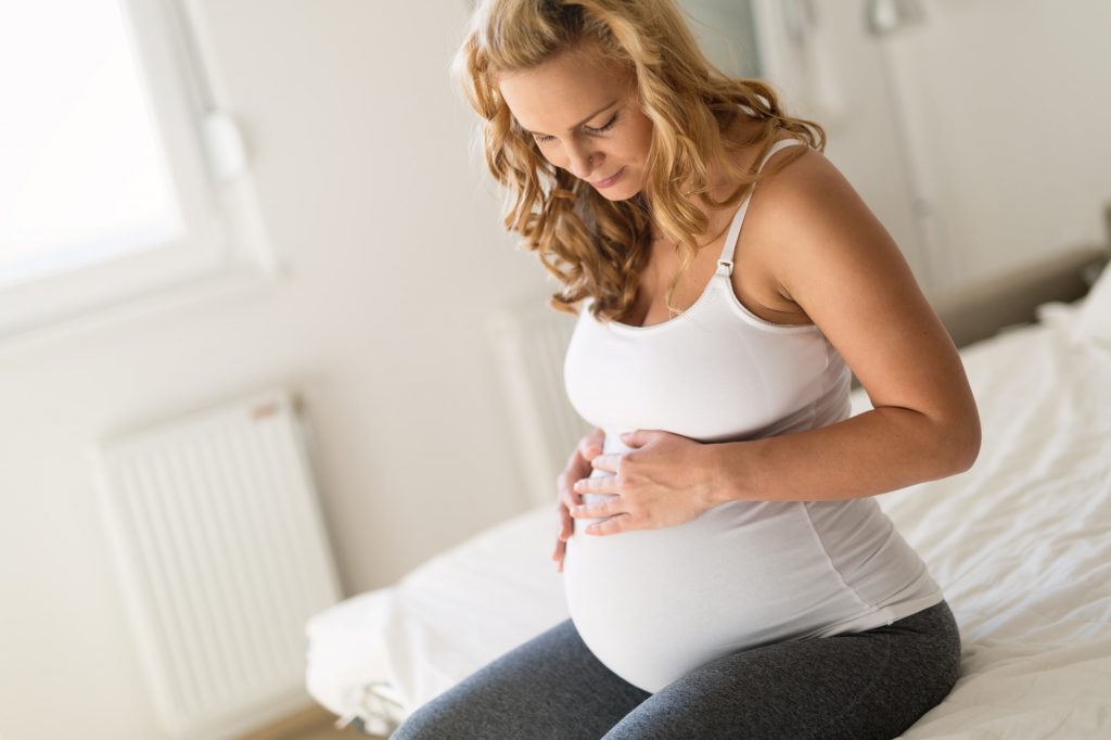 Proud pregnant woman expecting baby